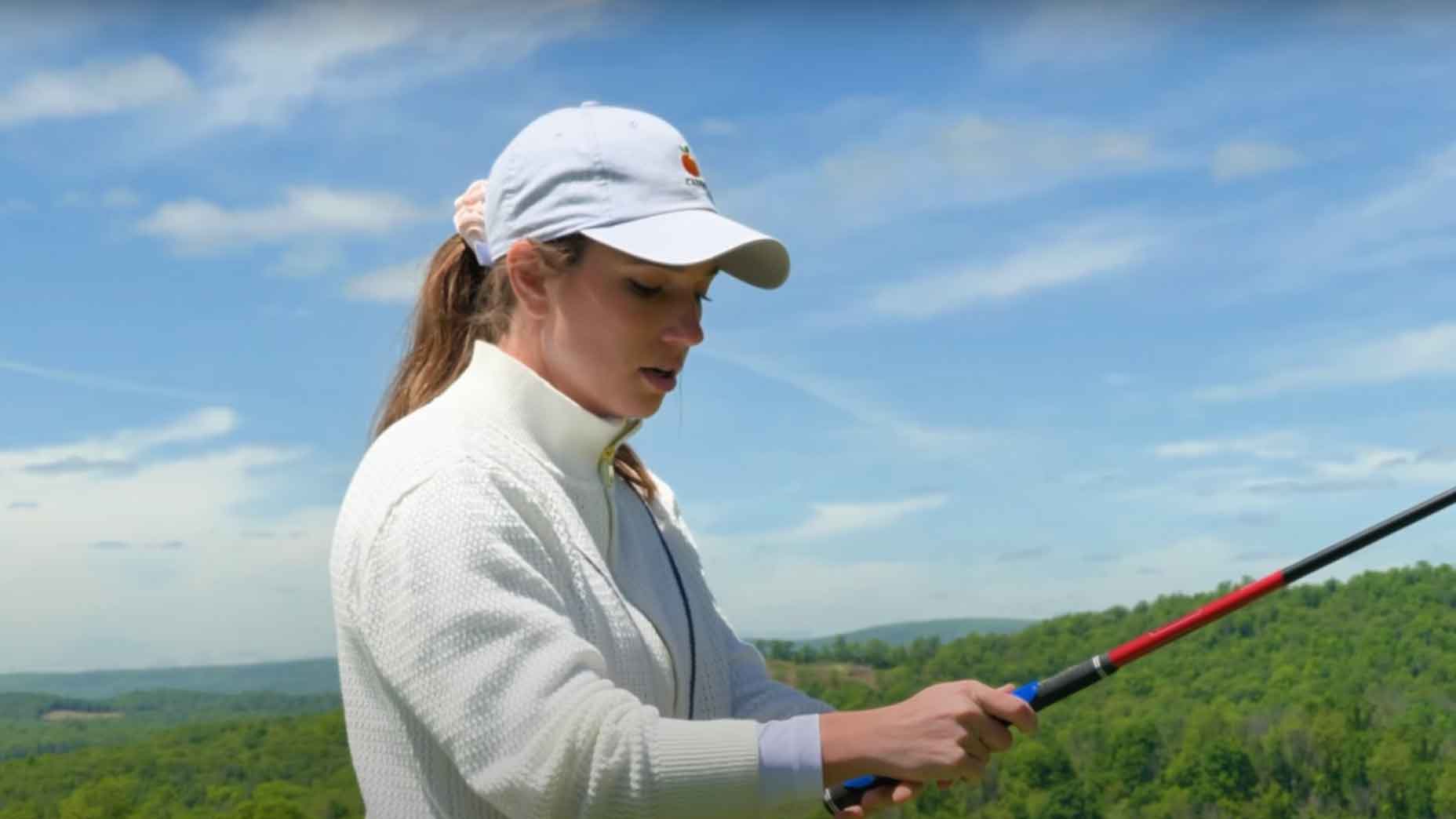 Maddi MacClurg using grip trainer